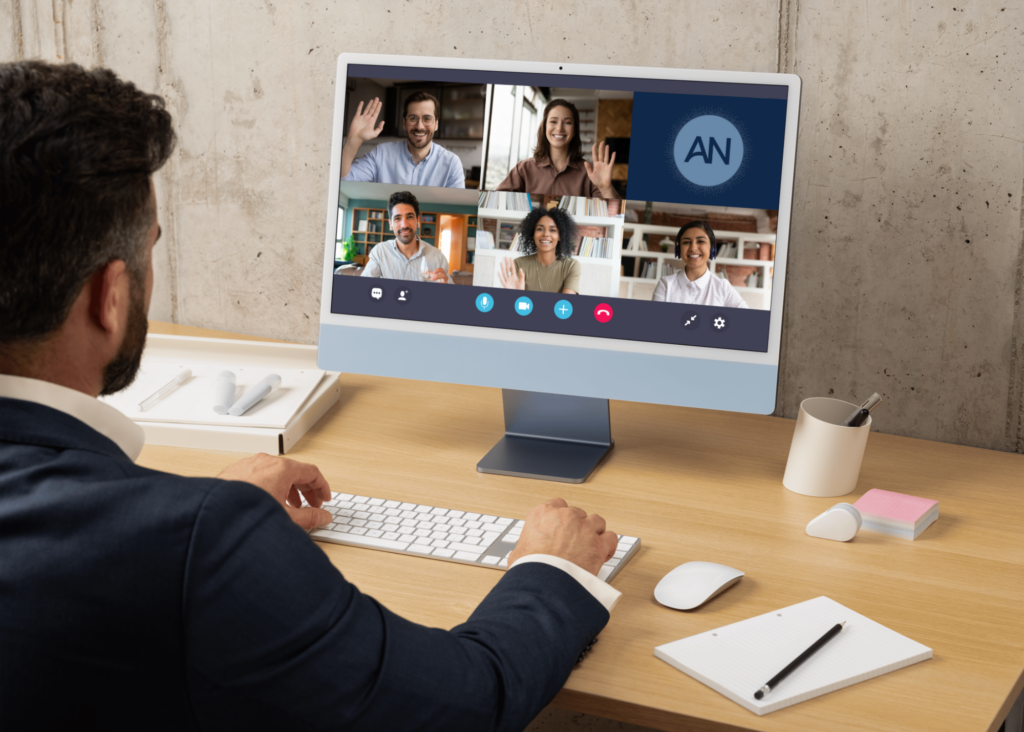 Man using his computer to join a virtual meeting with a team while documenting meeting minutes using Ari