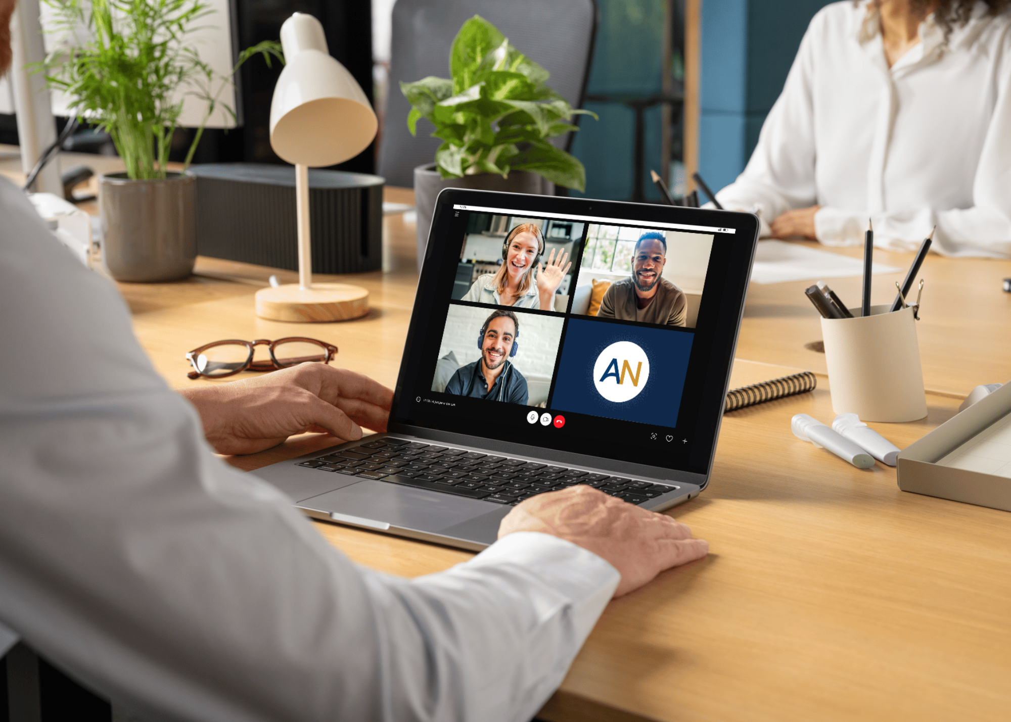 Man attending a virtual meeting on his laptop while an AI Note Taker captures detailed meeting notes