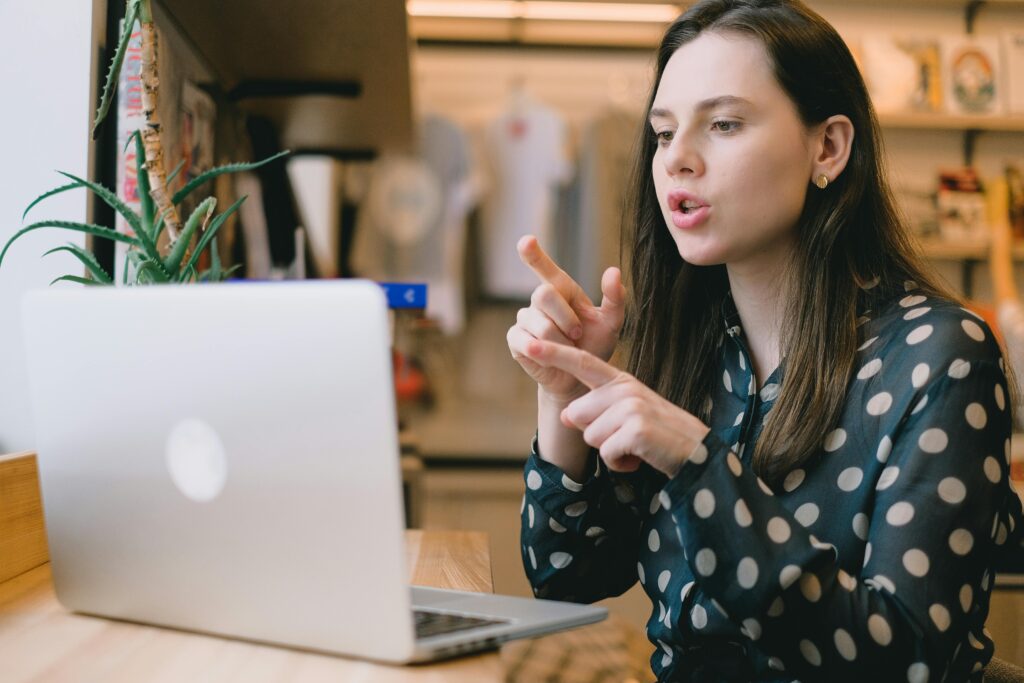 Woman in a virtual meeting using an AI note taker to document discussions