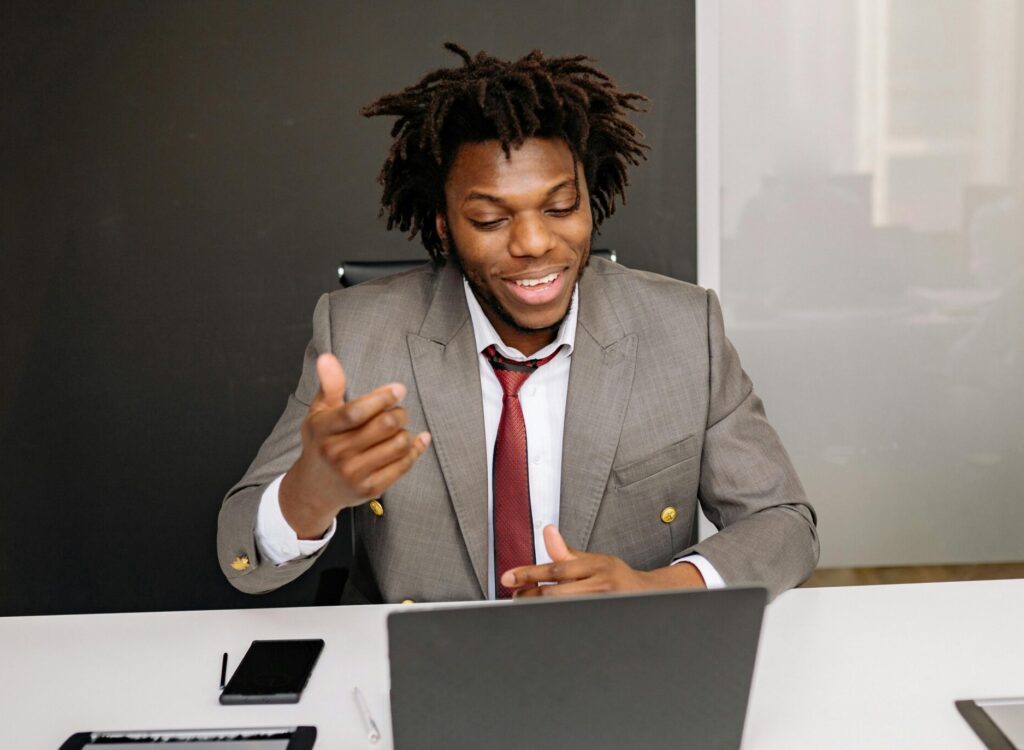 Man in a virtual meeting using an AI note taker to record key points