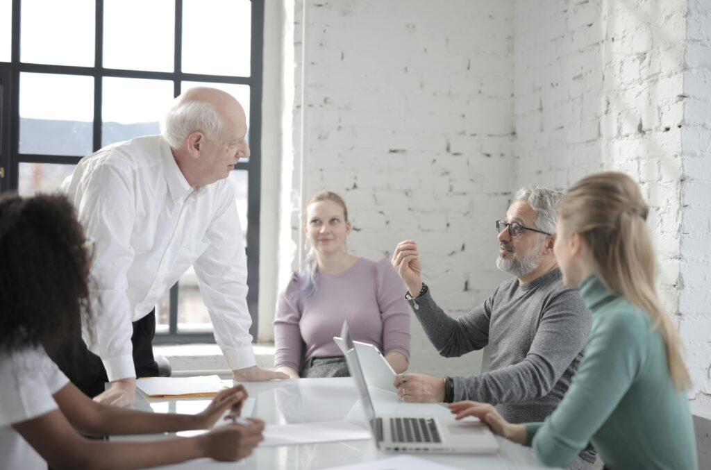 Team aligning on secure by design priorities in a casual project meeting
