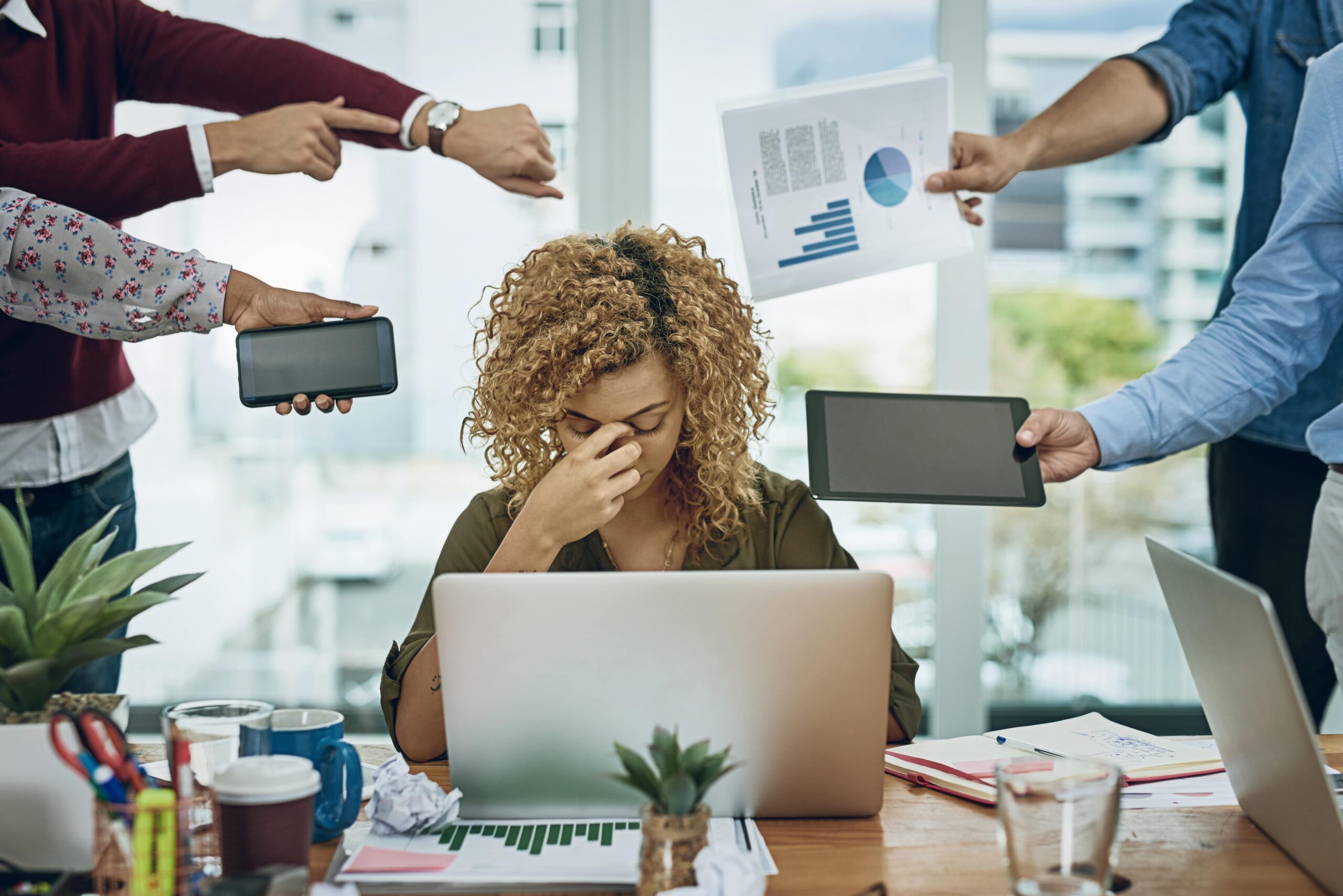 business women is stressed out, sitting in office