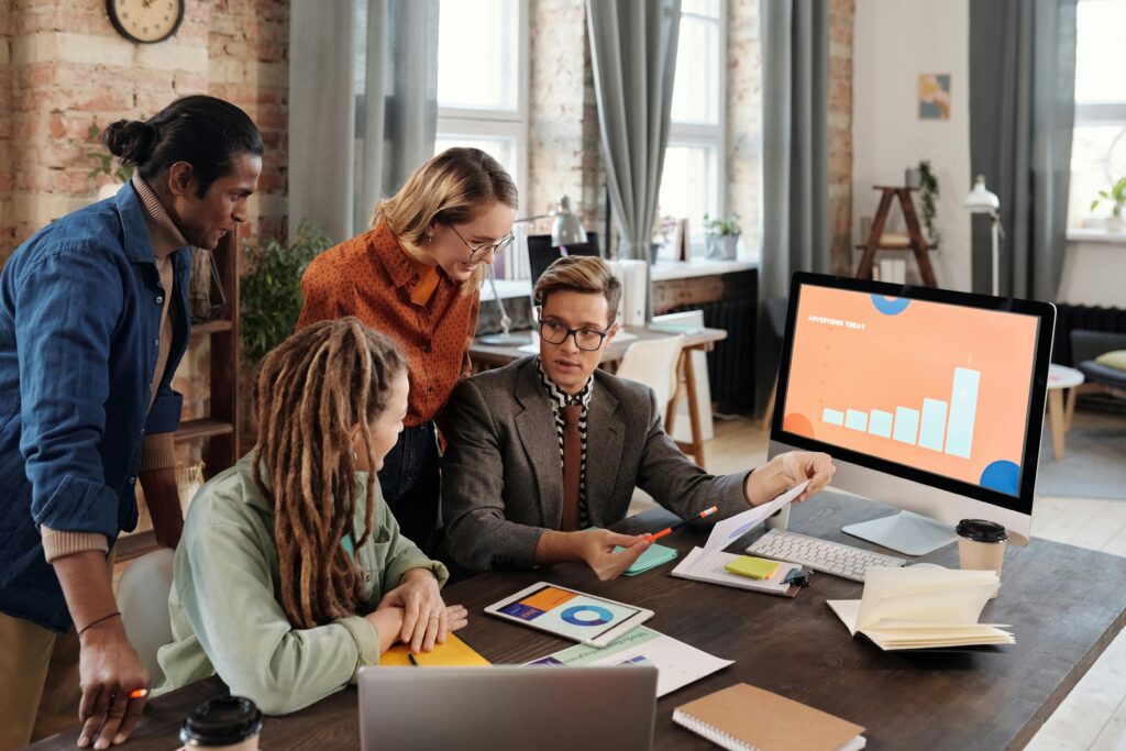 Team analyzing insights and action items generated by an AI Meeting Note-Taker during their meeting